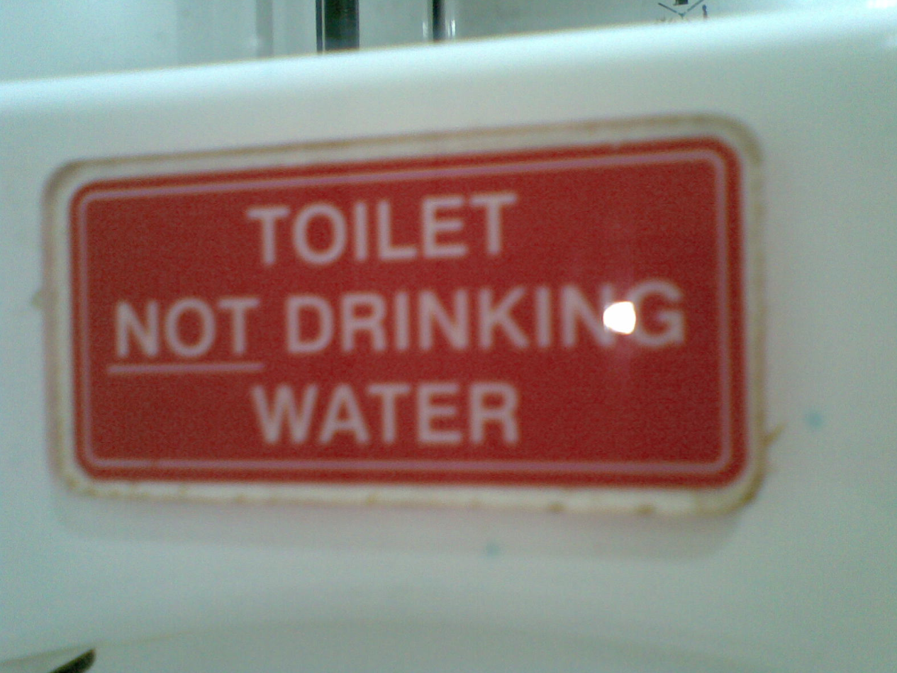 A warning sign which reads: "toilet NOT drinking water"