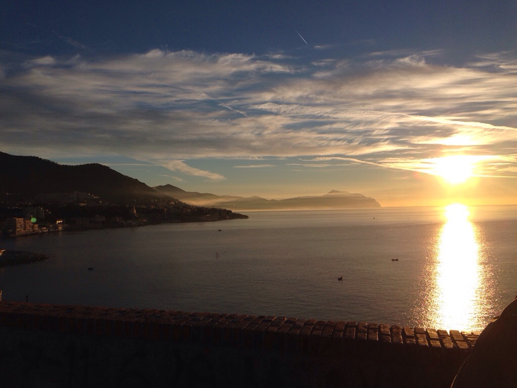Photograph of sun setting over the sea in Genoa