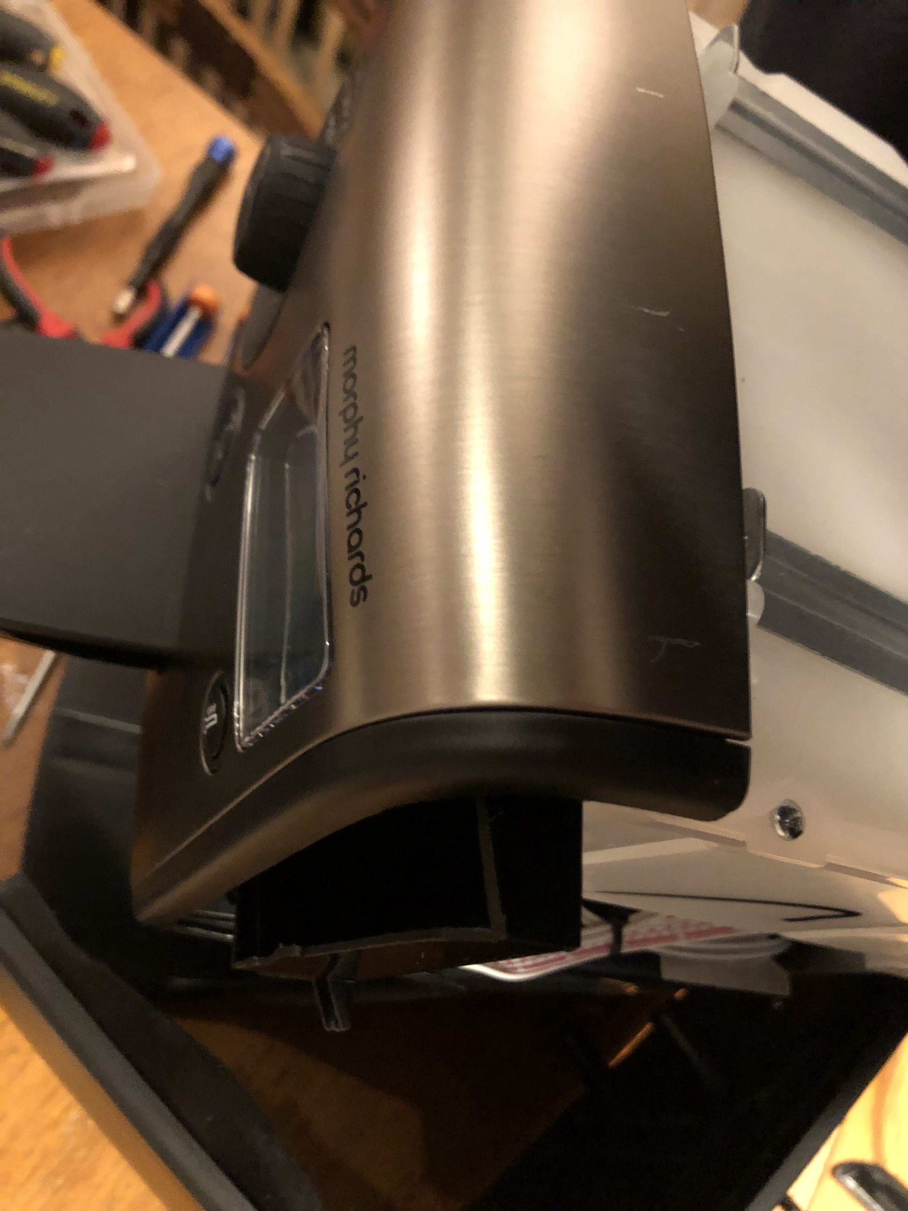 Black plastic board cover being slid out