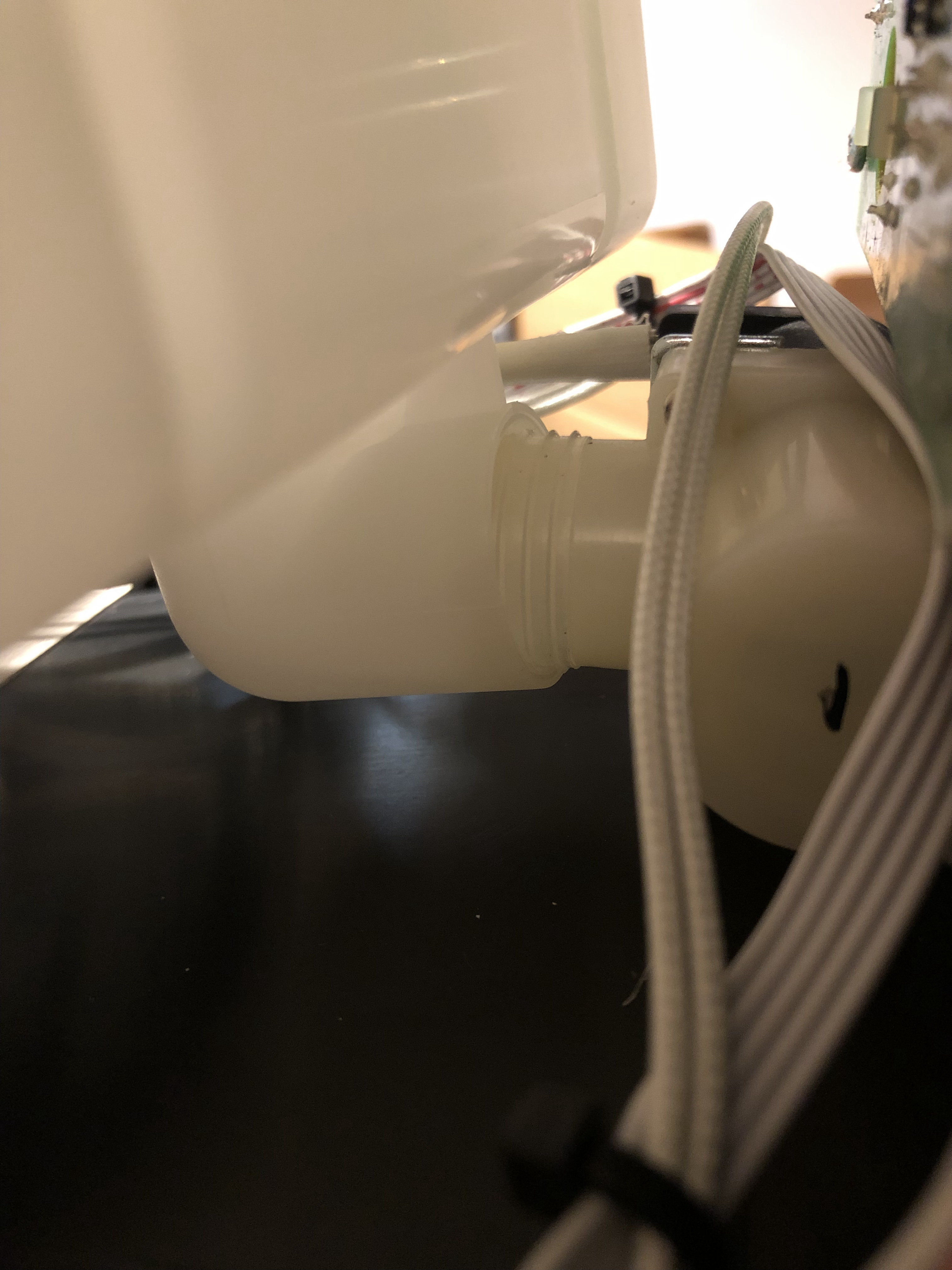 The pressure-fit join between the heating tank and the valve, partially pulled apart