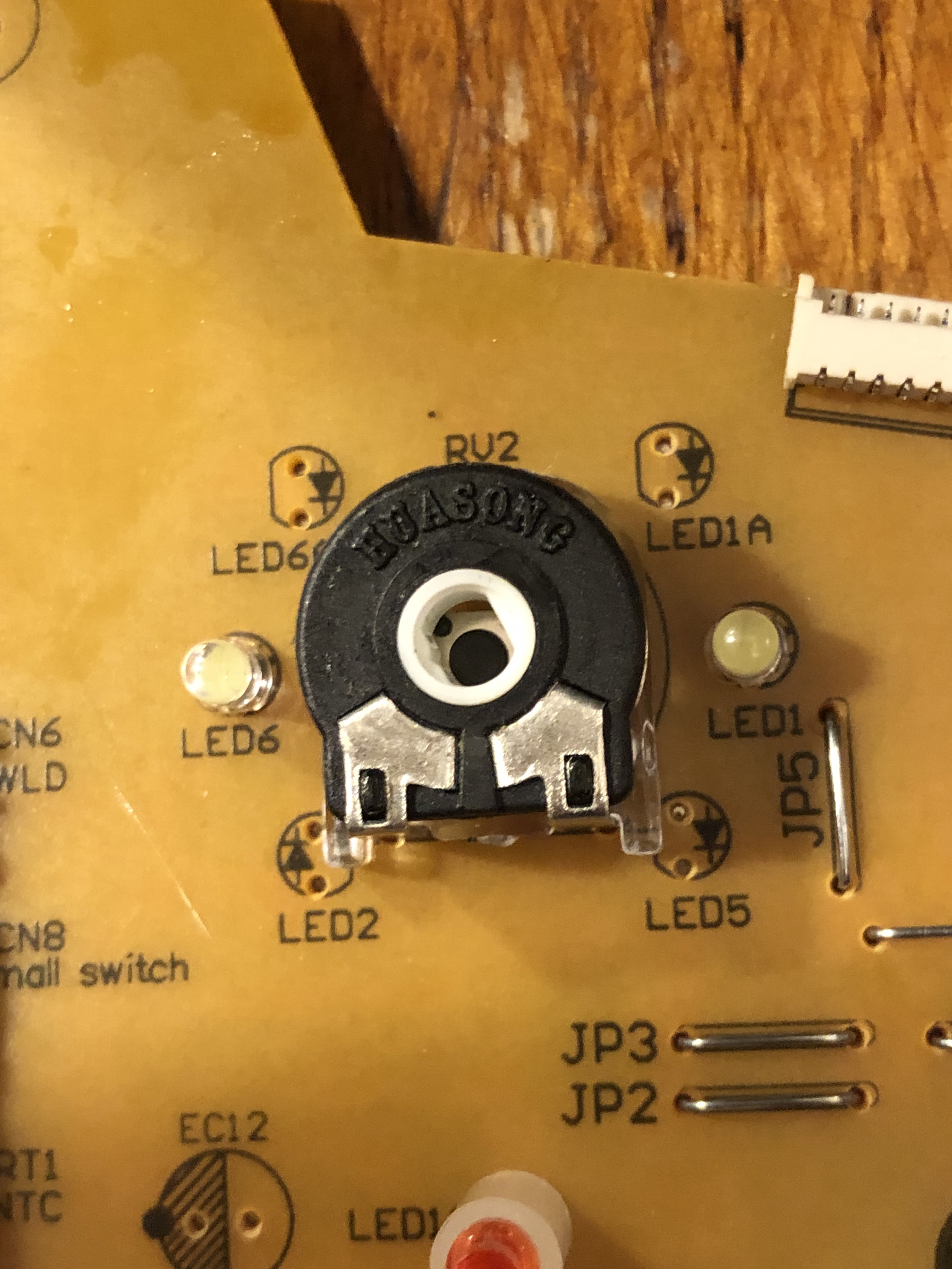 Close up of the variable resistor, there's a button mounted behind the hole.